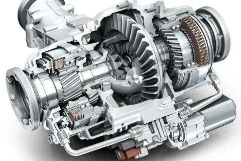 Przekrój mechanizmu różnicowego z widocznymi kołami zębatymi, łożyskami i elementami sprzęgła.