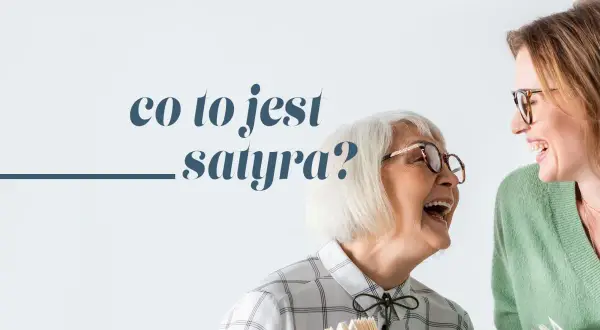 Dwie kobiety śmieją się, trzymając książki. Jedna z nich pyta: "Co to jest satyra?".