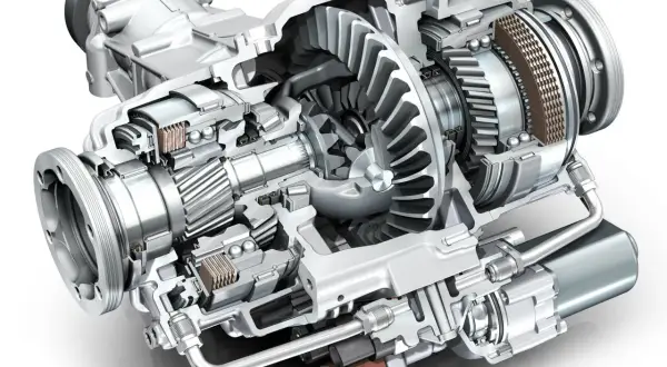 Przekrój mechanizmu różnicowego z widocznymi kołami zębatymi, łożyskami i elementami sprzęgła.