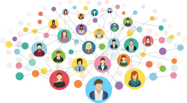 Wielobarwna sieć połączeń między ikonami ludzi symbolizuje networking i budowanie relacji.
